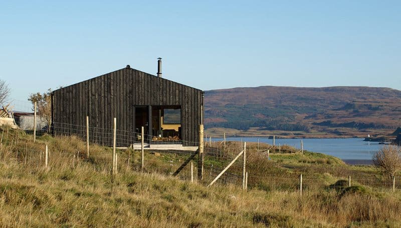 Black Shed Log cabin by Loch Nell on a grassy hillock